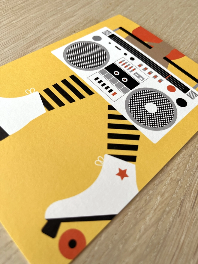 Greetings card with roller boots and boom box