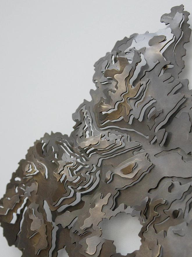 Close up side view of the Snowdonia National Park contour map wall piece showing the 3D effect 