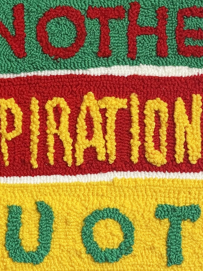 red wool type on a green box background, yellow narrow type on a red background and green type on a yellow woollen background 