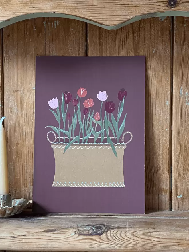 A print of a decorative tub of pink Tulips 