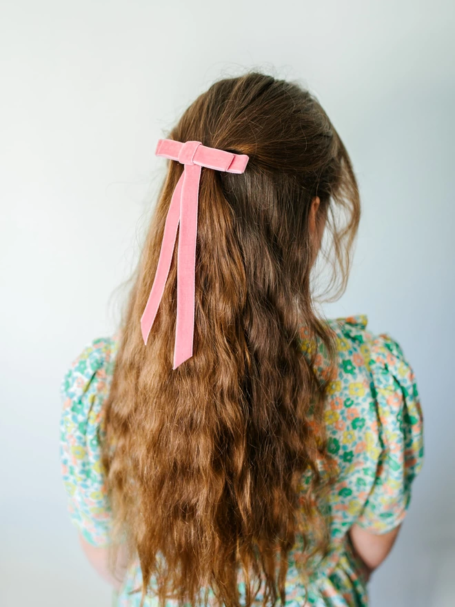 girl with pink bow