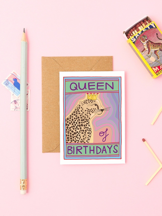 A female mini birthday card featuring a cheetah and the words 'queen of birthdays'