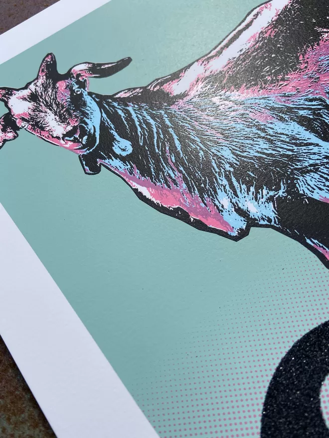 Glitter "GOAT" Hand Pulled Screenprint depicting a goat looking forward with the word GOAT underneath in black glitter and a pink to blue colour blend in the back ground 