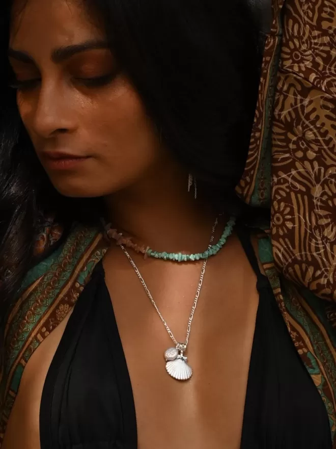 Model wearing silver Finders Keepers Shell pendant with small baroque pearl and turquoise chip choker by Loft & Daughter