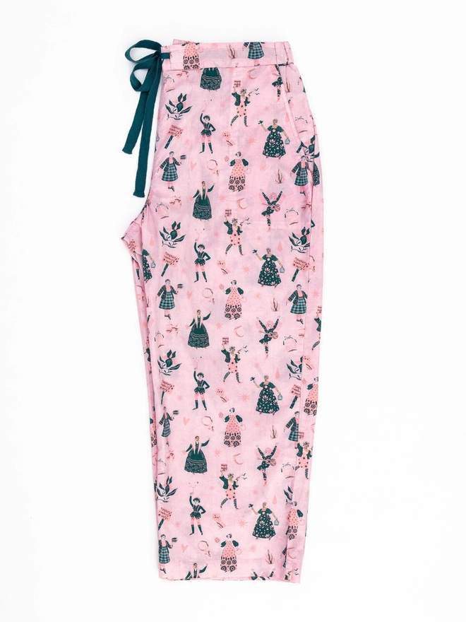 A flat image of Black & beech feminist pyjama bottoms, side view