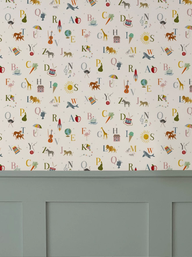 ABC Nursery Wallpaper on wall above blue wall panelling