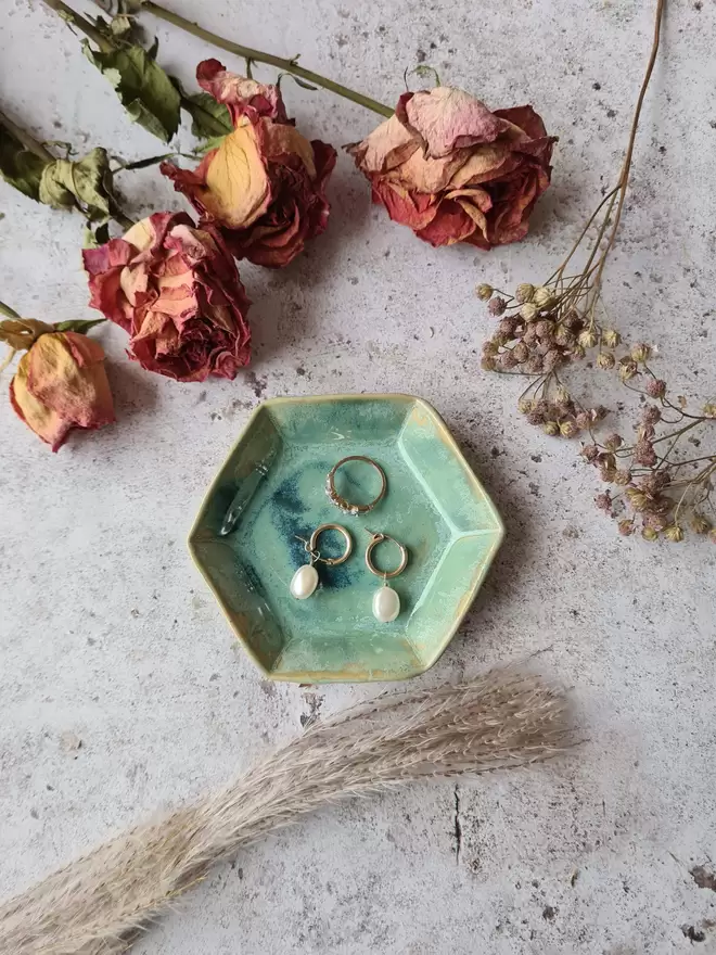 Mini Hexagon Trinket Jewellery Ring dish, ceramic dish, pottery dish, gift, homeware, Jenny Hopps Pottery Photographed on a mottled white backdrop with dried flowers and earrings, turquoise aqua green