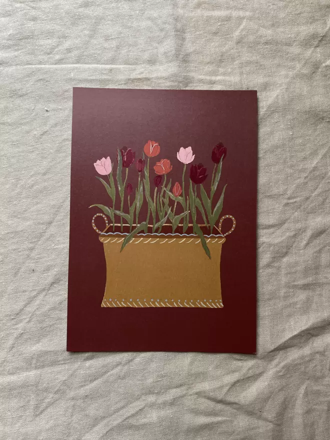 A print of a decorative tub of pink Tulips 