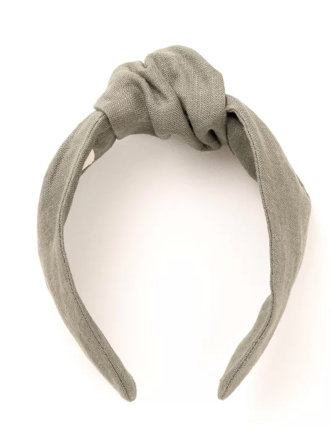 Vanessa Rose Amelia Hairband in Sage Green seen front on.