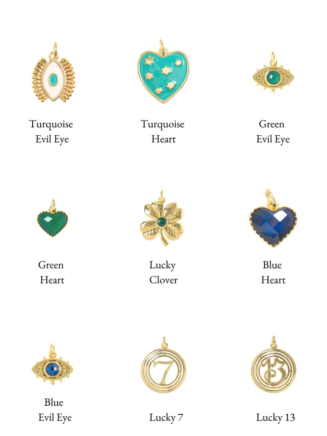 Blue, green, turquoise and gold vintage style lucky charms on a white background