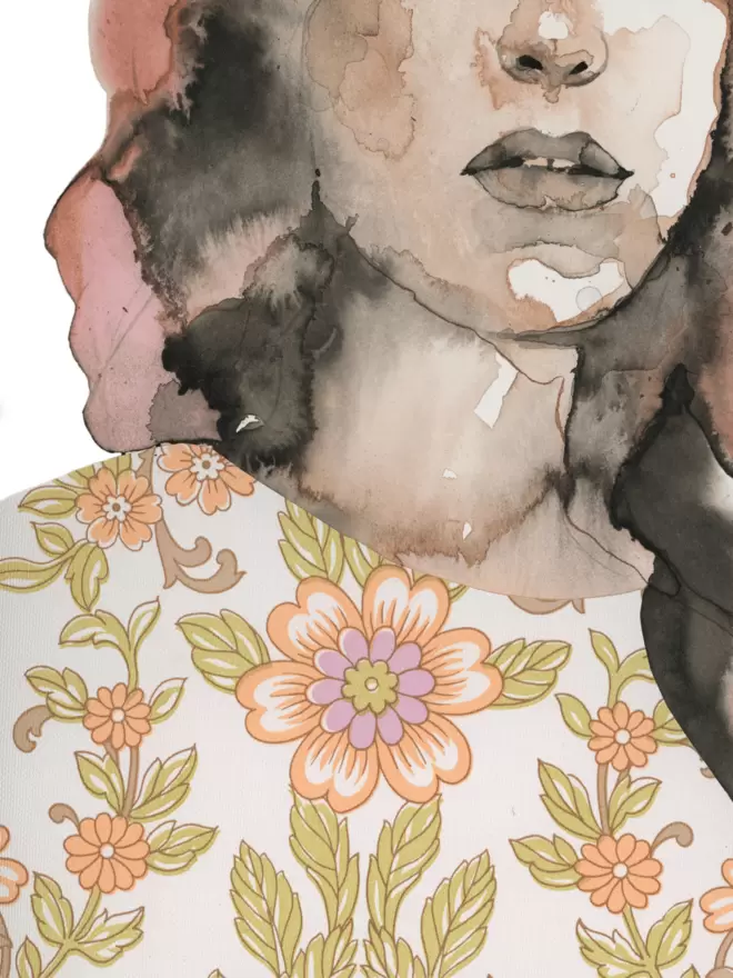In this image you can see the details of the floral print on the top the woman wears.