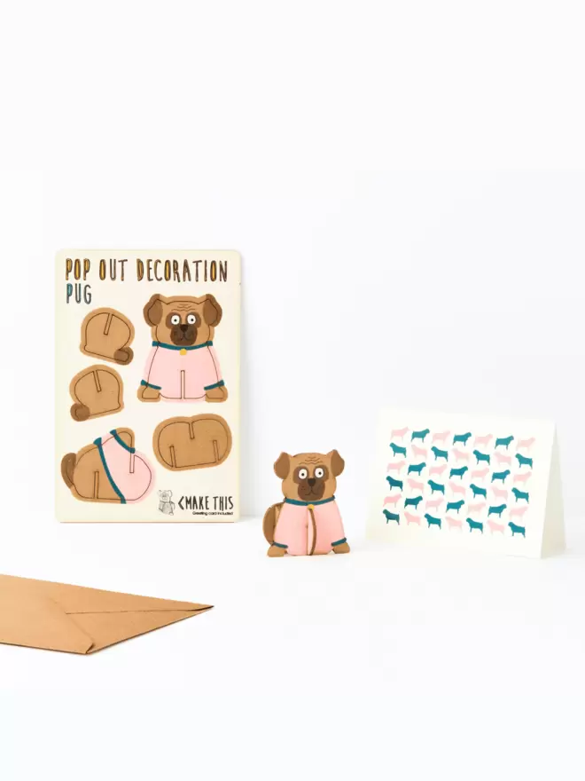 Pug decoration and Pug pattern greeting card and brown kraft envelope on a white background