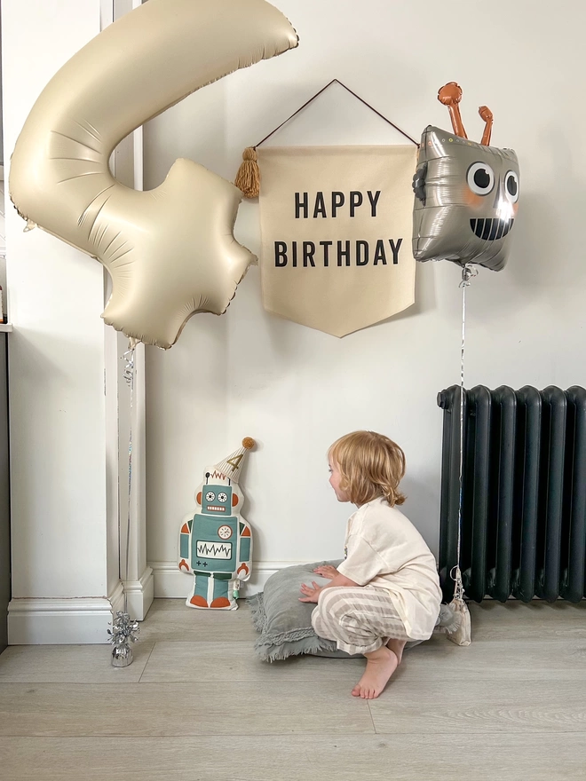Birthday Banner and Robot wearing Caramel Striped Party Hat