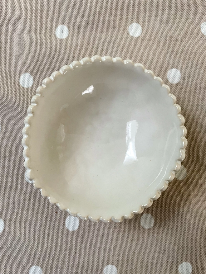 small white handmade ceramic pottery bowl scalloped edge