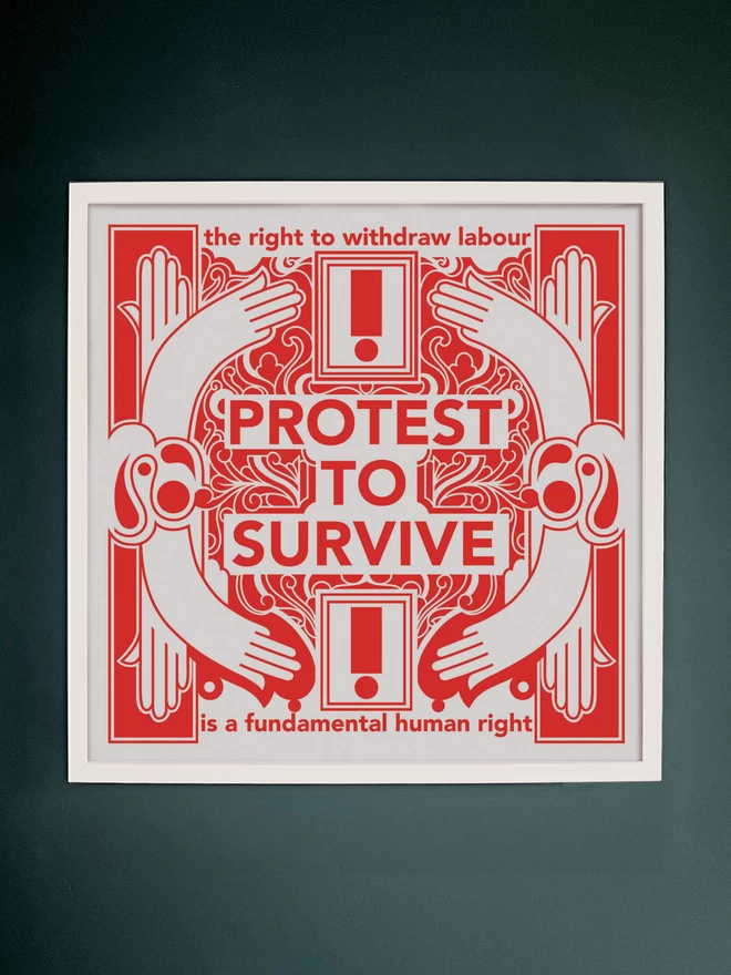 The bold red and white print with "Protest to survive" written at the centre, as well as “the right to withdraw labour” at the top, and “is a fundamental human right” at the bottom sits in a white frame, hung on a dark grey wall.
