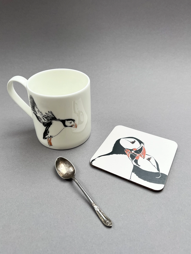 A puffin mug and coaster to accompany the card