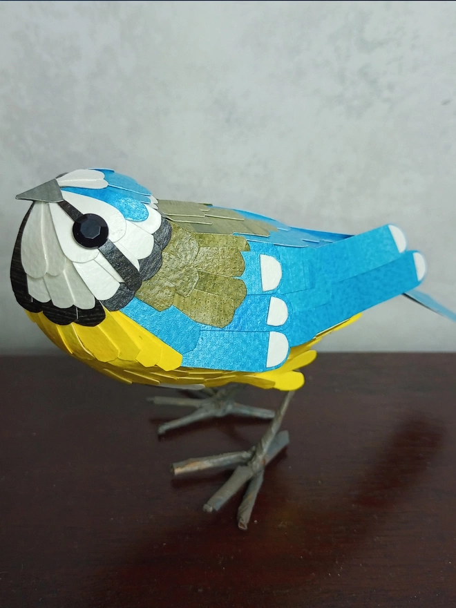 Blue tit bird standing sculpture