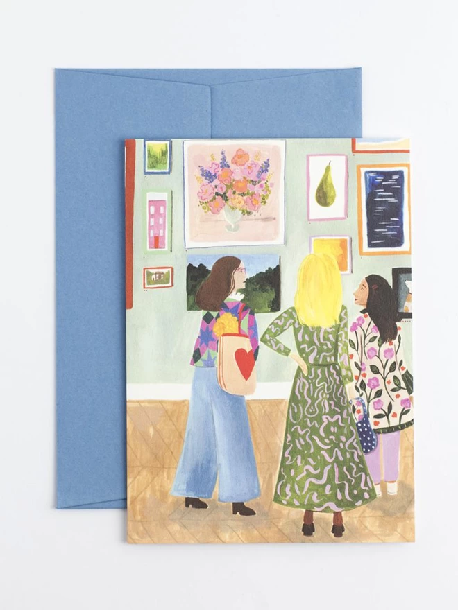 An illustration of three women admiring an exhibition in a brightly painted gallery. The women are all wearing brightly coloured clothes and a looking at a painting of a pear and a colourful bouquet of flowers