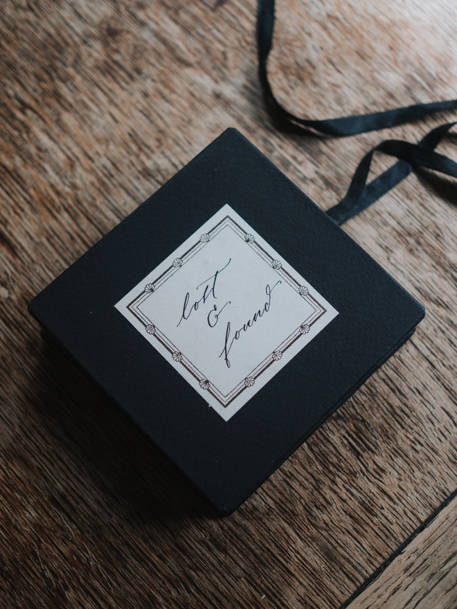 Square back album with silk ribbon ties and a vintage style label with the words 'lost & found' written in calligraphy