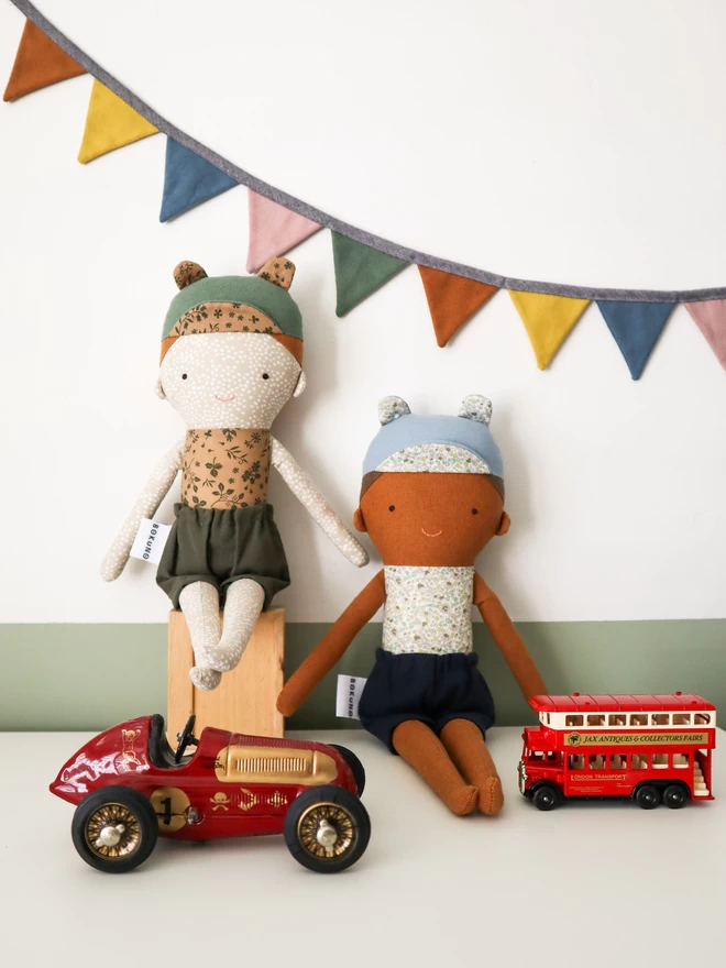 Boy dolls with freckles and brown skin with retro car toy